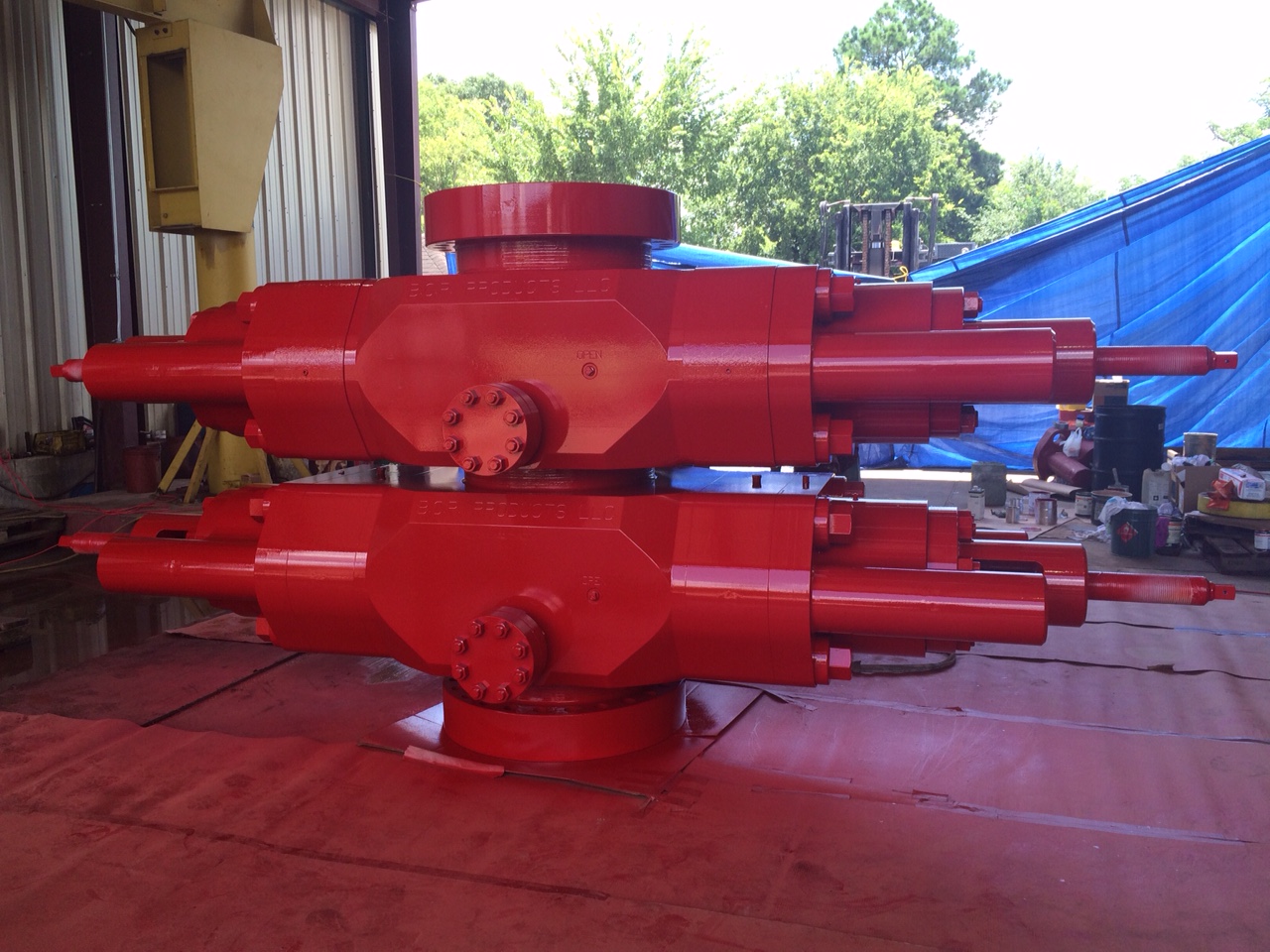 Red ram-type blowout preventer component used in oil and gas drilling operations for well pressure control