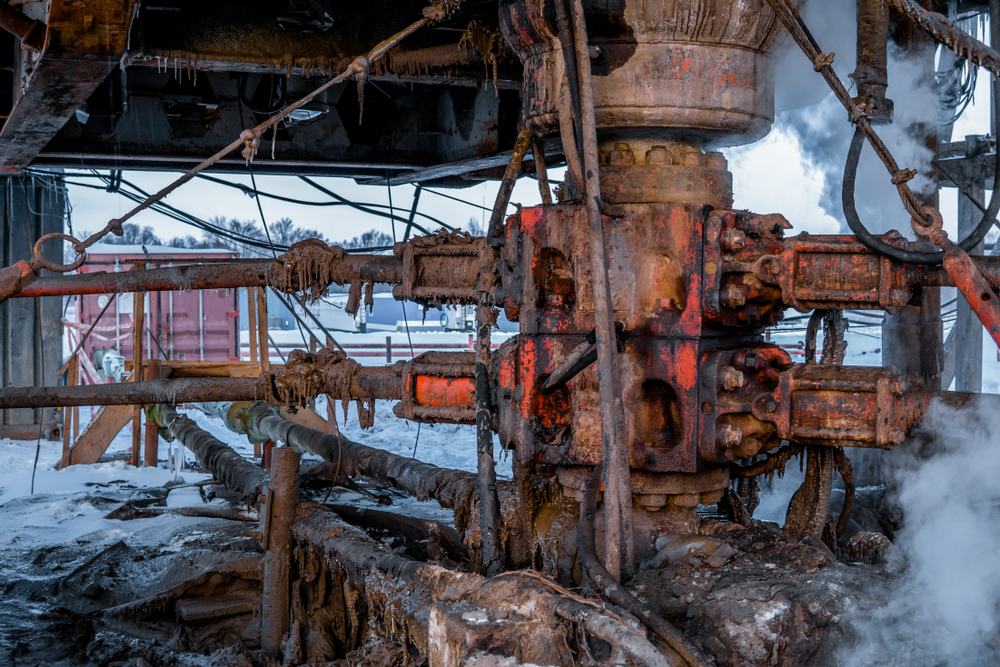 ADrillingRigIsPreparingToInstallTheBlowoutPreventor Drilling rig preparing to install a blowout preventer BOP